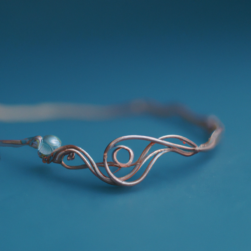 Close-up of handcrafted wire wrapped copper and silver pendant on a minimal white background